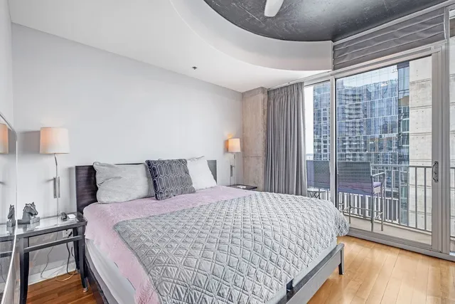 a dining room with furniture and wooden floor