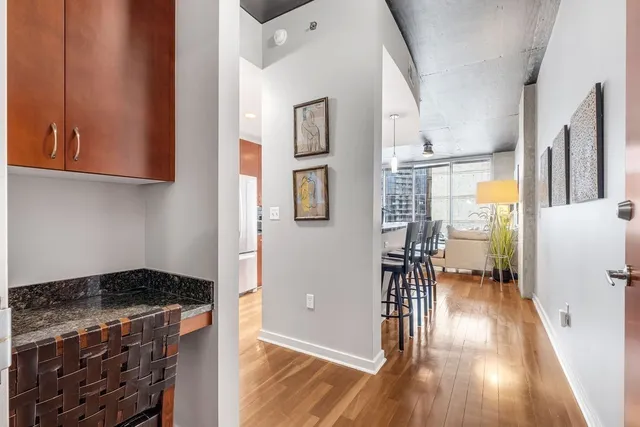 a kitchen with granite countertop a stove and a refrigerator