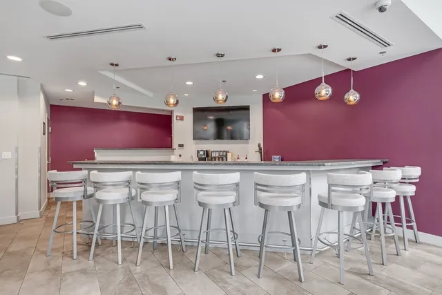 a view of a livingroom with furniture and a flat screen tv