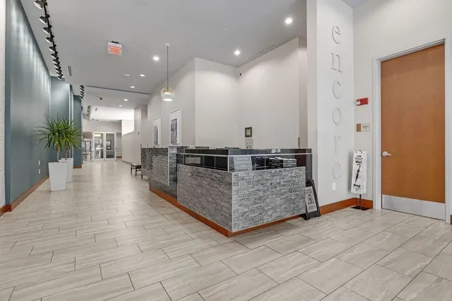 a view of swimming pool with outdoor seating