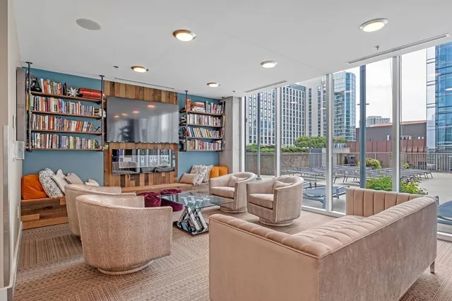 a view of a terrace with furniture and chandelier