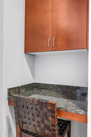 a kitchen with stainless steel appliances granite countertop a stove a sink a refrigerator and a microwave