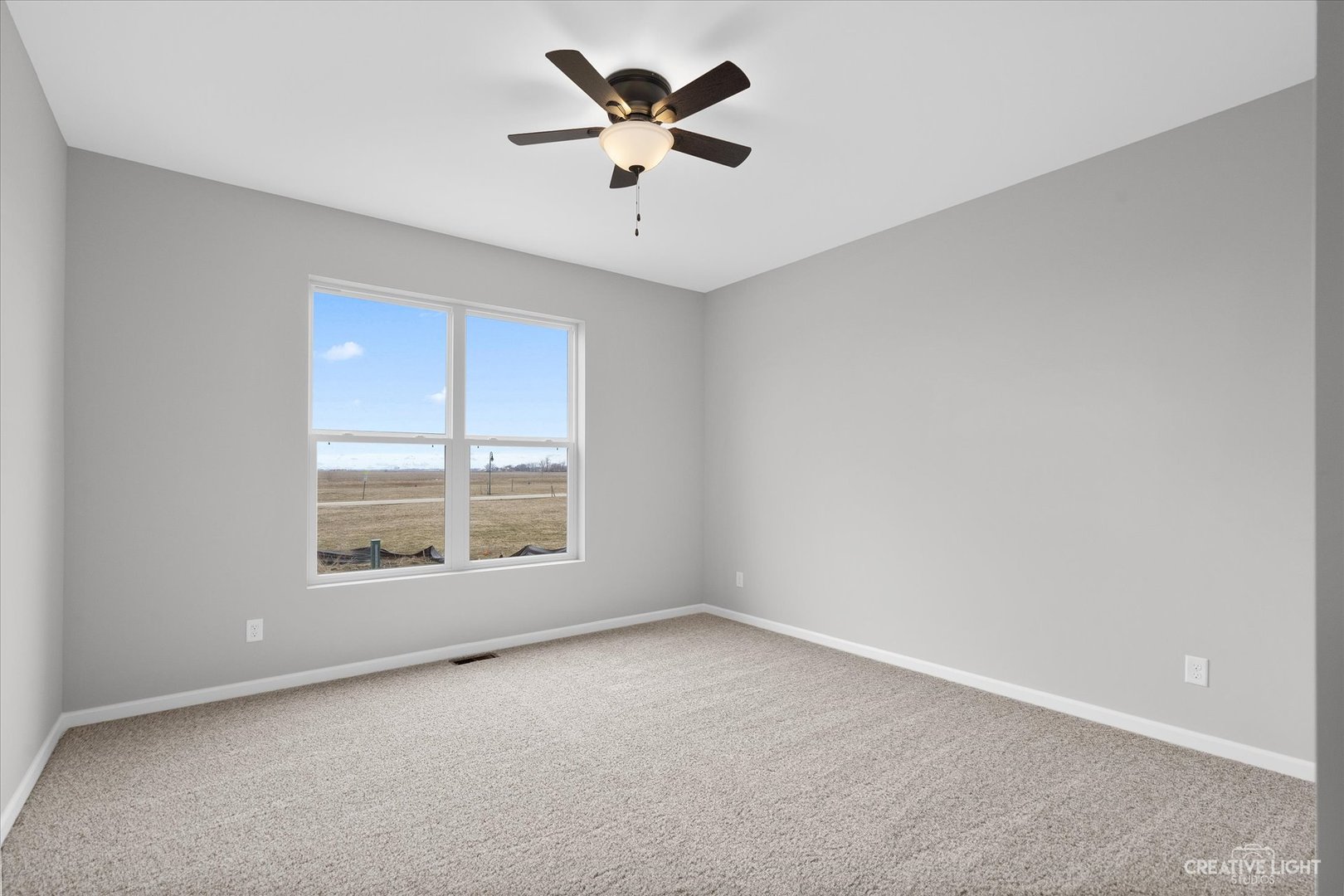 501 Hahn Drive Cortland, IL 60112 - Photo 14 of 27 a view of an empty room with a window