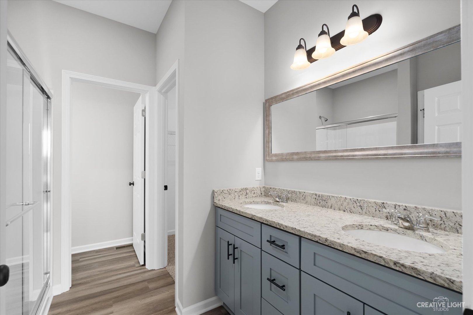 501 Hahn Drive Cortland, IL 60112 - Photo 15 of 27 a bathroom with a sink and a mirror
