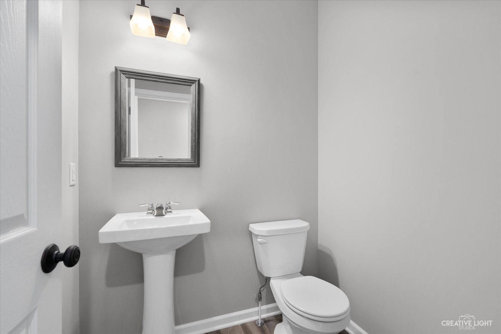 501 Hahn Drive Cortland, IL 60112 - Photo 16 of 27 a white toilet sitting next to a bathroom sink