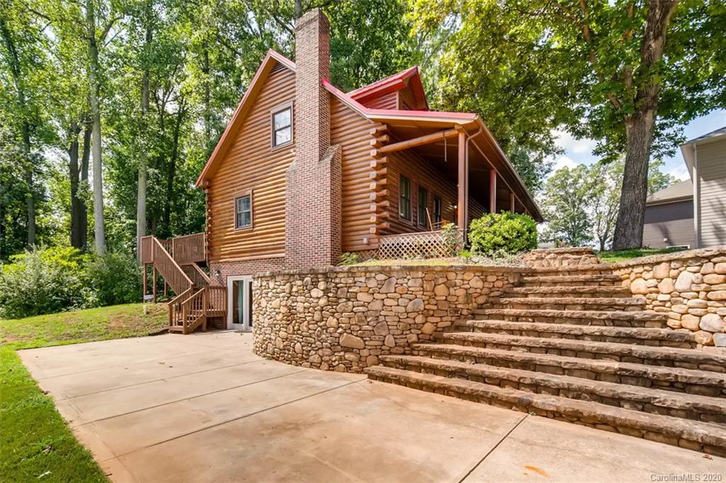 4323 Hubbard Road Charlotte, NC 28269 - Photo 2 of 35 a view of house with backyard