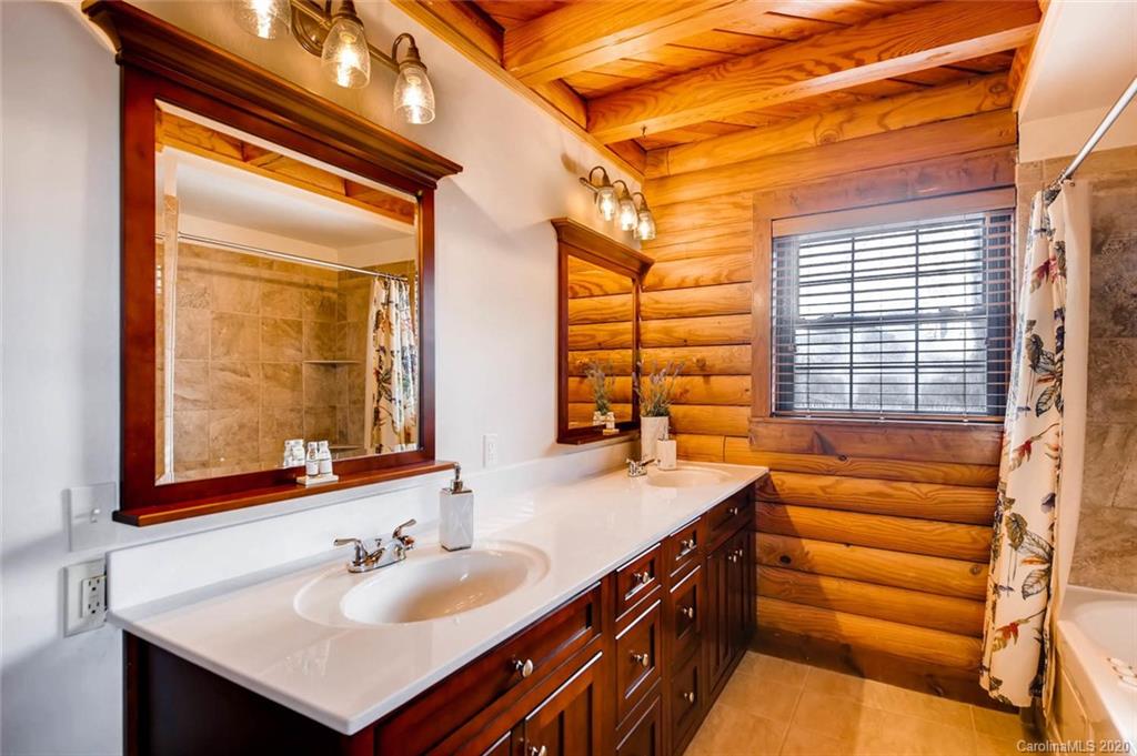 4323 Hubbard Road Charlotte, NC 28269 - Photo 12 of 35 a bathroom with a sink and a mirror