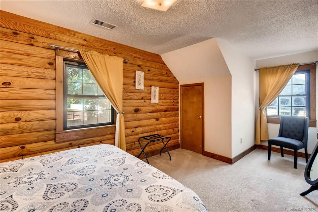 4323 Hubbard Road Charlotte, NC 28269 - Photo 16 of 35 a bedroom with a bed and a dresser