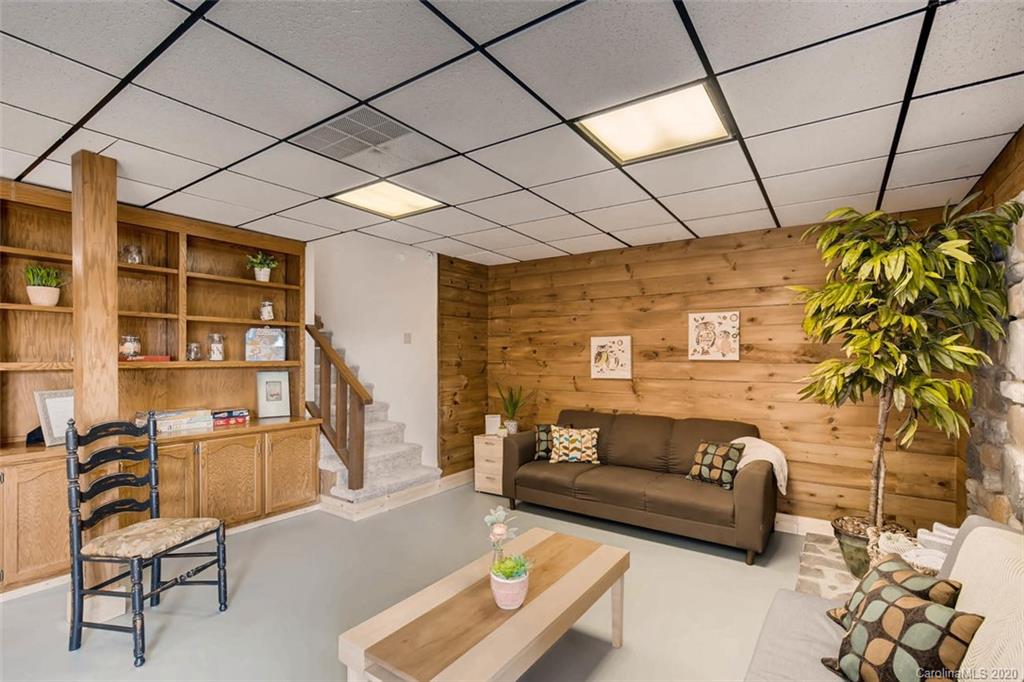 4323 Hubbard Road Charlotte, NC 28269 - Photo 22 of 35 a living room with furniture a couch and a potted plant