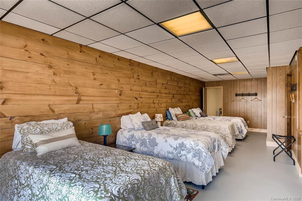 4323 Hubbard Road Charlotte, NC 28269 - Photo 23 of 35 a bedroom with two beds and a lamp