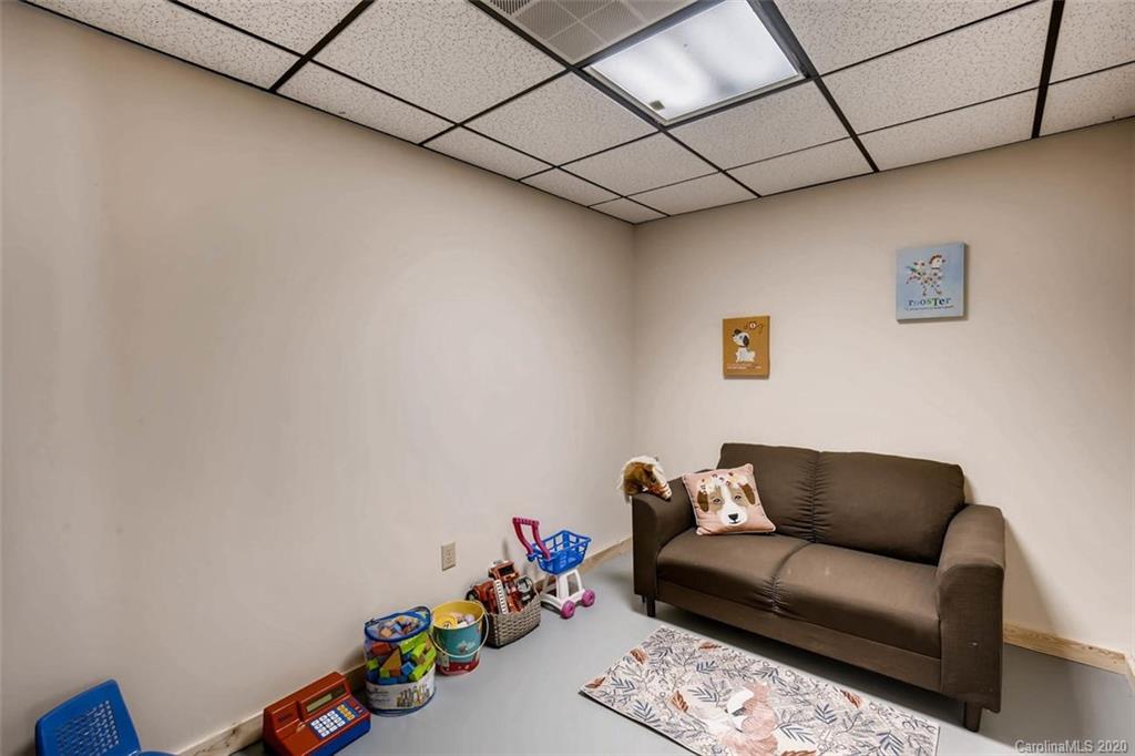 4323 Hubbard Road Charlotte, NC 28269 - Photo 27 of 35 a living room with furniture and toys