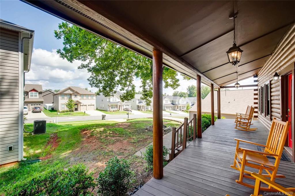 4323 Hubbard Road Charlotte, NC 28269 - Photo 31 of 35 a view of a porch with furniture and wooden floor