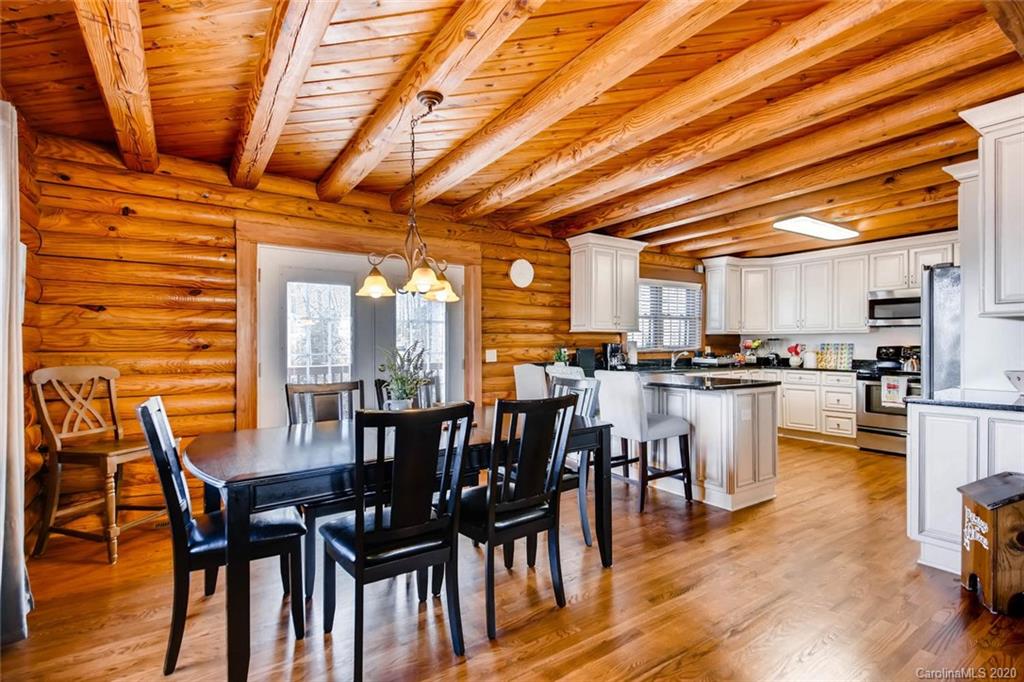 4323 Hubbard Road Charlotte, NC 28269 - Photo 6 of 35 a view of a dining room with furniture and wooden floor