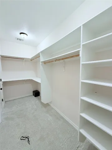 a view of an empty room with empty racks