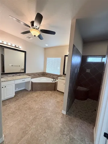 a living room with stainless steel appliances kitchen island granite countertop furniture and a view of living room