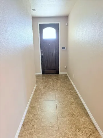 an empty room with a mirror