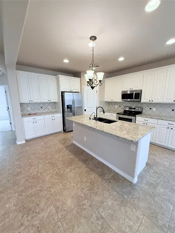 a large kitchen with cabinets