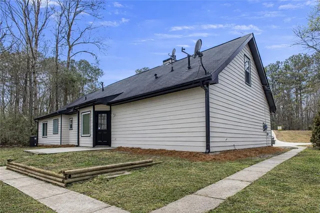 a backyard of a house with lots of green space