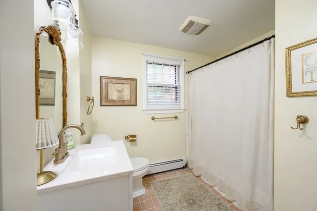 a bathroom with a sink a mirror and a shower