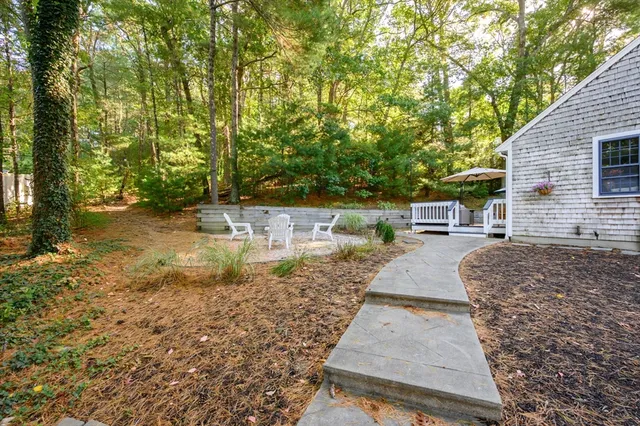 a backyard of a house with lots of green space