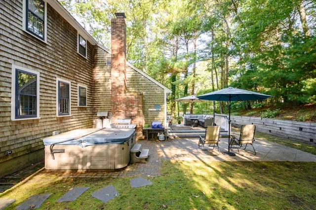 a view of a patio with two chairs and a table