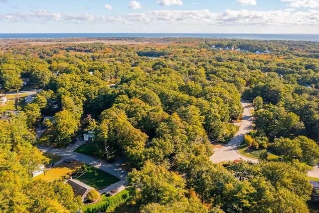 a picture of a bathroom with a shower and a mirror