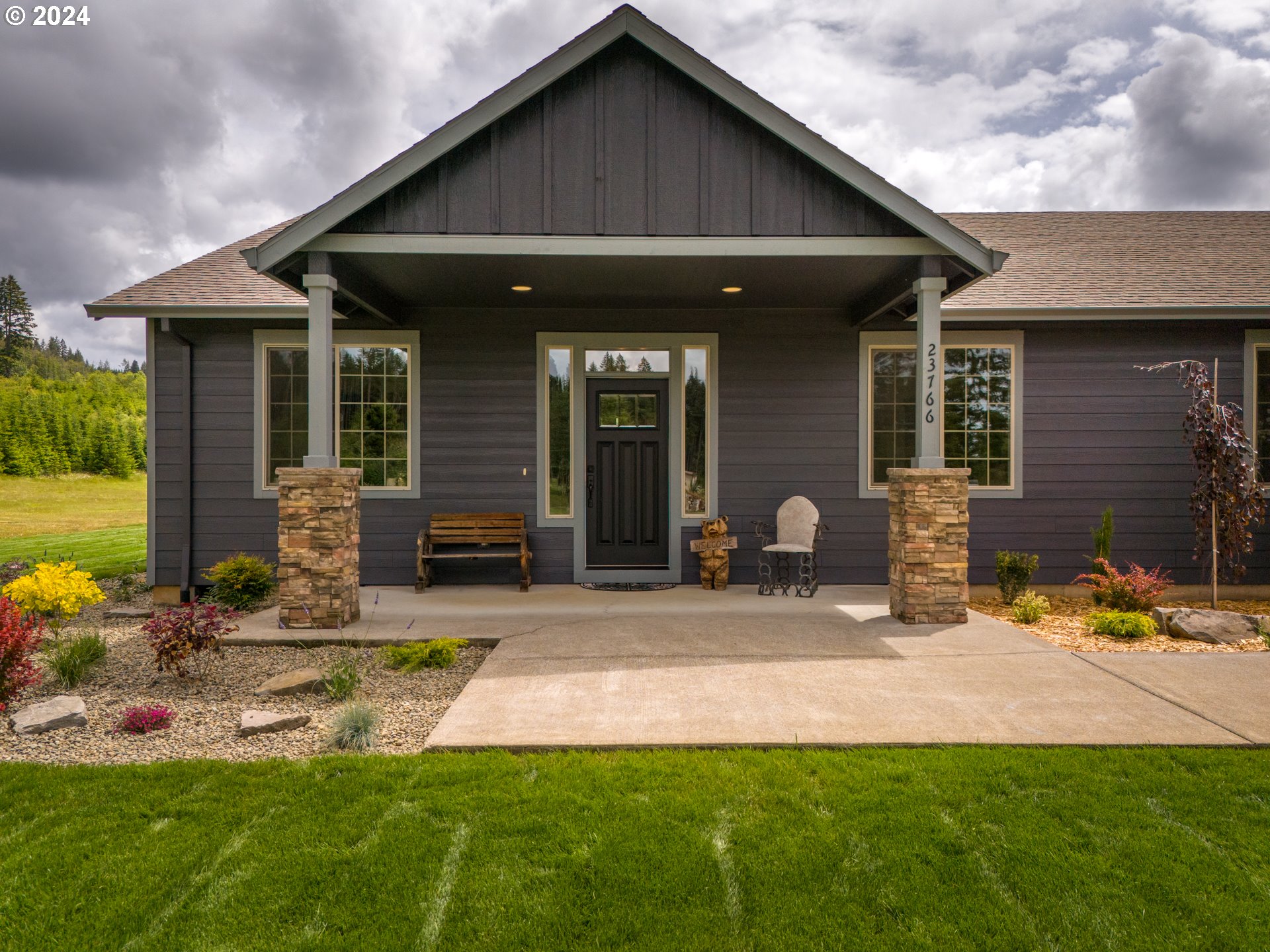 23766 South Bonney Road Colton, OR 97017 - Photo 3 of 32 a front view of a house with garden