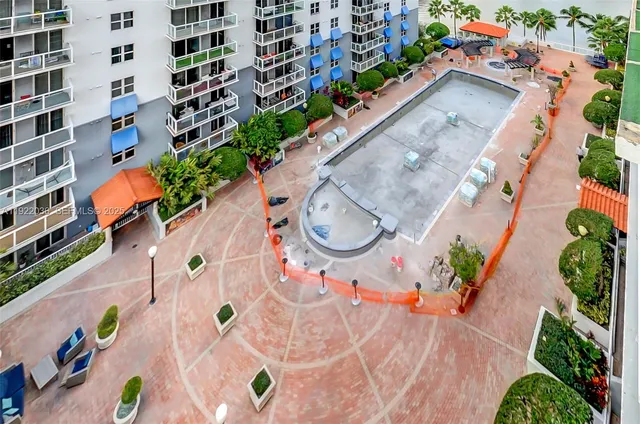 a living room with lots of tables and a flat screen tv