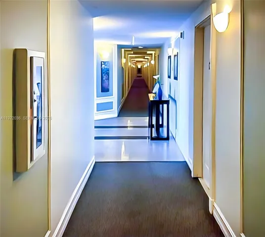 a view of a hallway with wooden floor and stairs