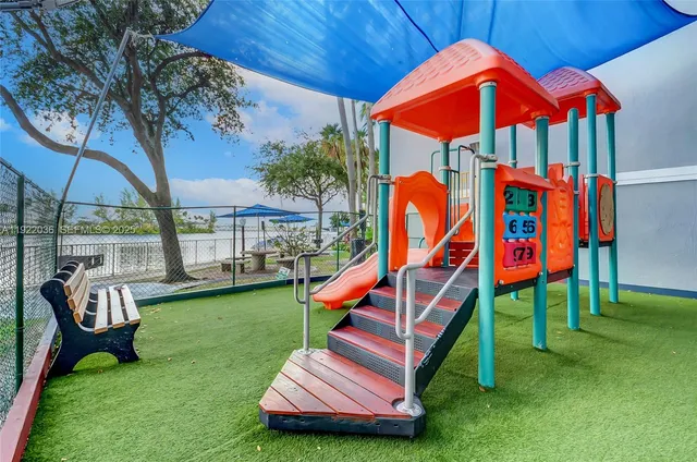 a backyard of a house with outdoor seating