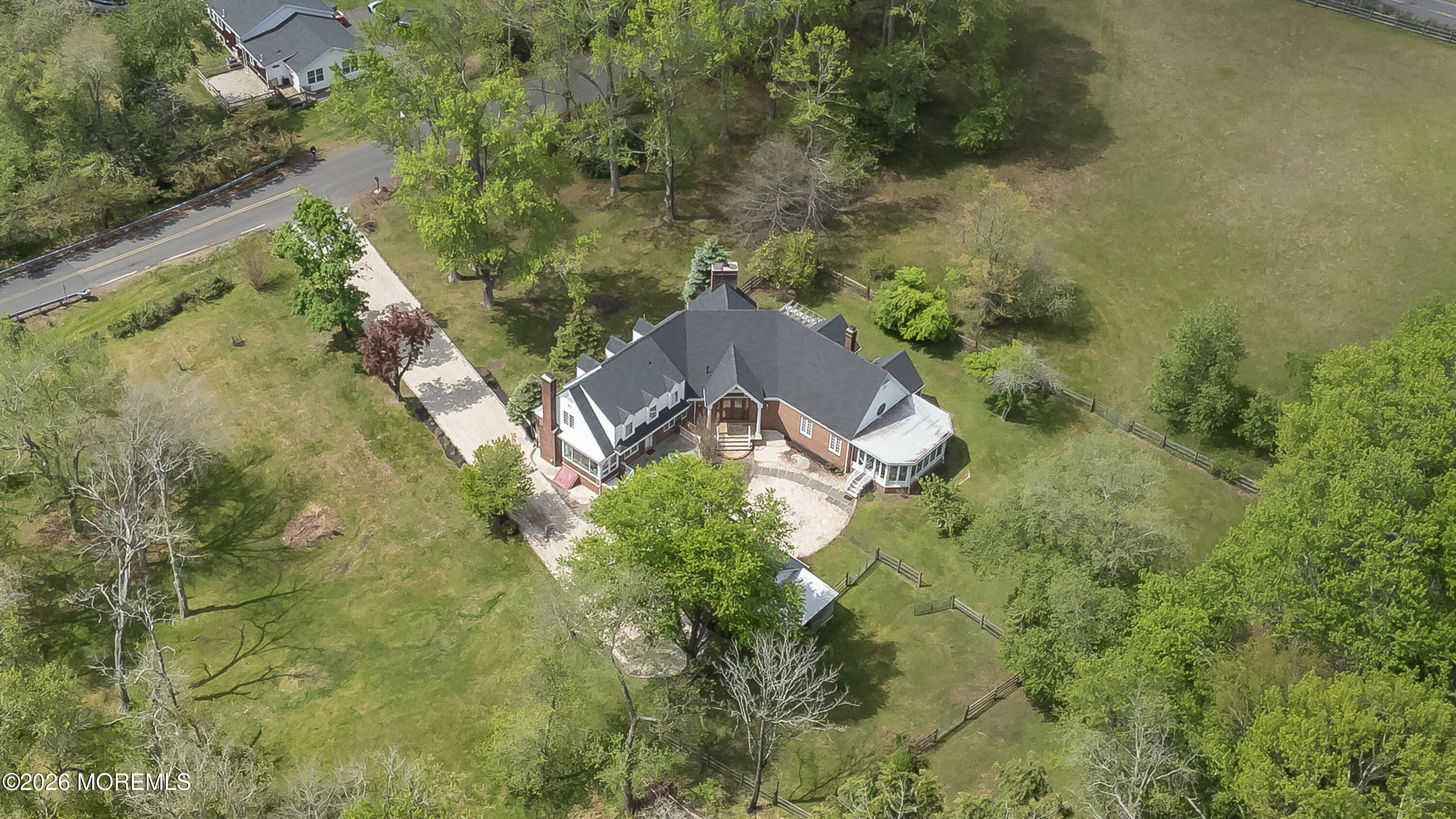 187 Hockhockson Road Colts Neck, NJ 07722 - Photo 53 of 55 an aerial view of a house with a yard