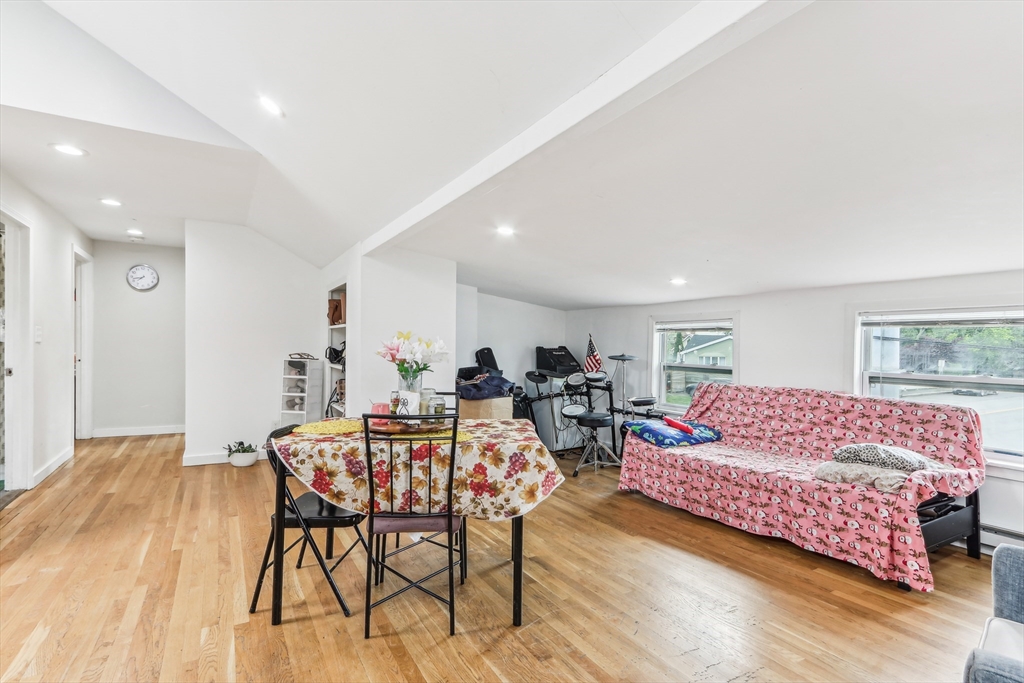 831 North Shore Road Revere, MA 02151 - Photo 11 of 24 a living room with furniture and a wooden floor
