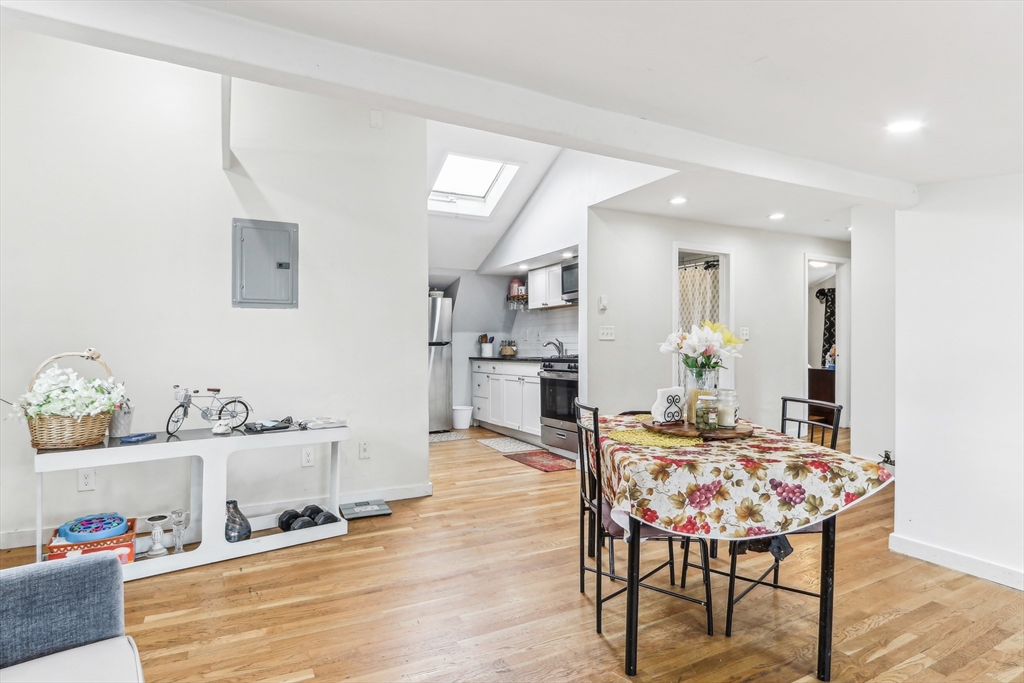 831 North Shore Road Revere, MA 02151 - Photo 12 of 24 a living room with furniture and a wooden floor