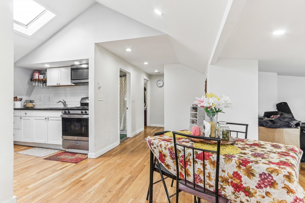 831 North Shore Road Revere, MA 02151 - Photo 13 of 24 a view of a dining room with furniture and wooden floor