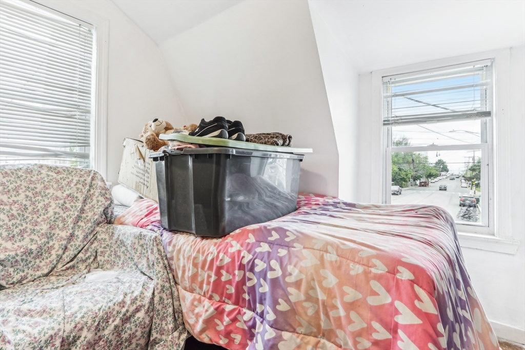 831 North Shore Road Revere, MA 02151 - Photo 14 of 24 a bedroom with a bed and a window