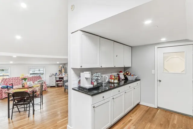 a kitchen with stainless steel appliances granite countertop a sink and cabinets