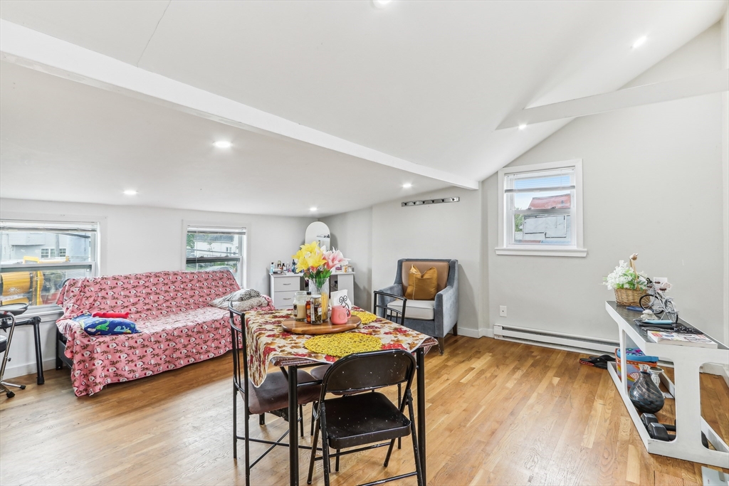 831 North Shore Road Revere, MA 02151 - Photo 10 of 24 a living room with furniture and wooden floor