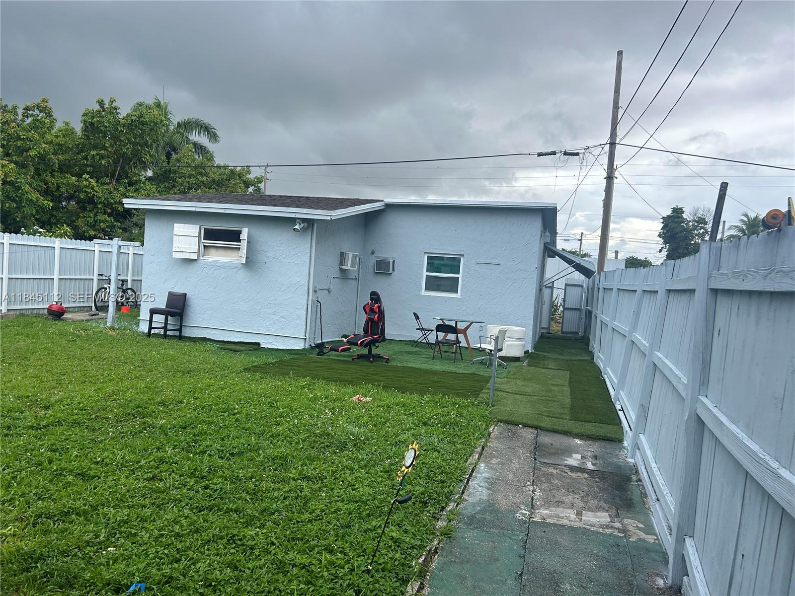 2708 Northwest 22nd Court Miami, FL 33142 - Photo 3 of 10 a front view of house with yard