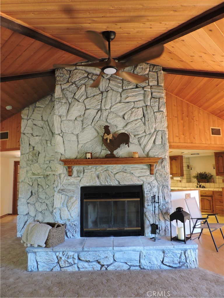 26931 Columbia Way Tehachapi, CA 93561 - Photo 29 of 49 Fireplace has 3 settings to emit heat and a gas starter.