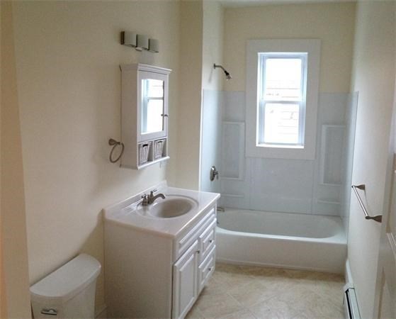 15 Romsey Street, Unit 3 Boston, MA 02125 - Photo 12 of 14 a bathroom with a sink a toilet and a bathtub