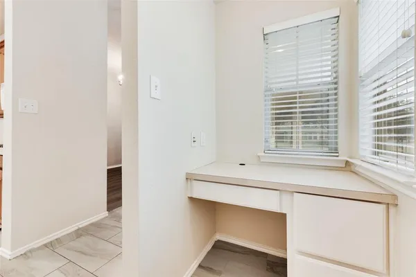 a room with washing machine and window