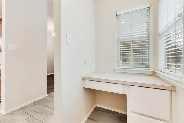 a room with washing machine and window