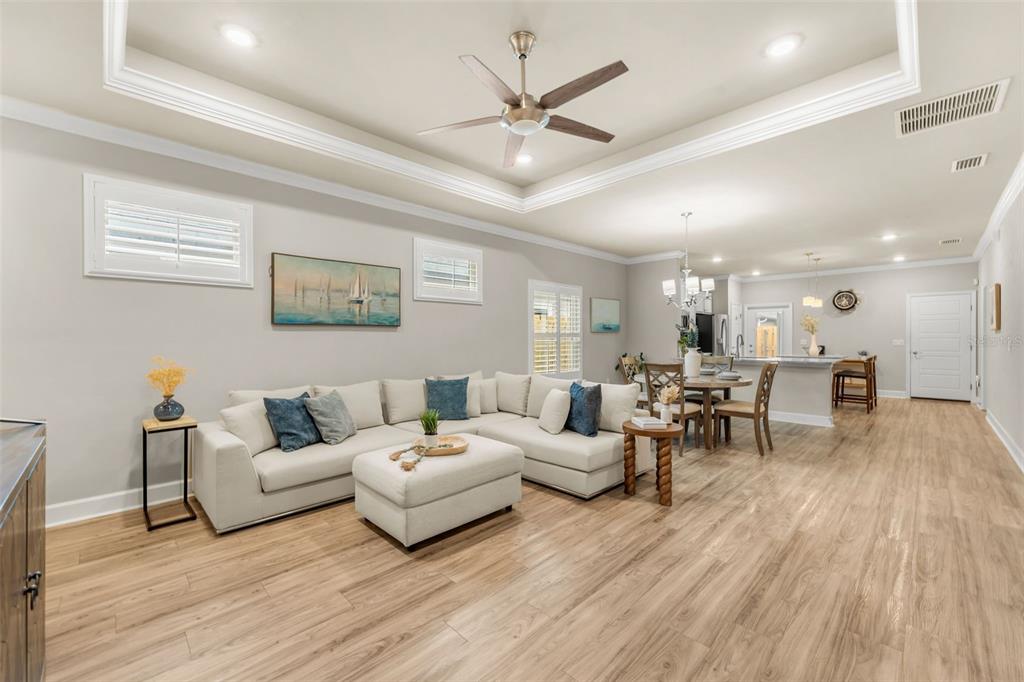 9437 Southwest 67th Lane Gainesville, FL 32608 - Photo 3 of 41 a living room with furniture and wooden floor