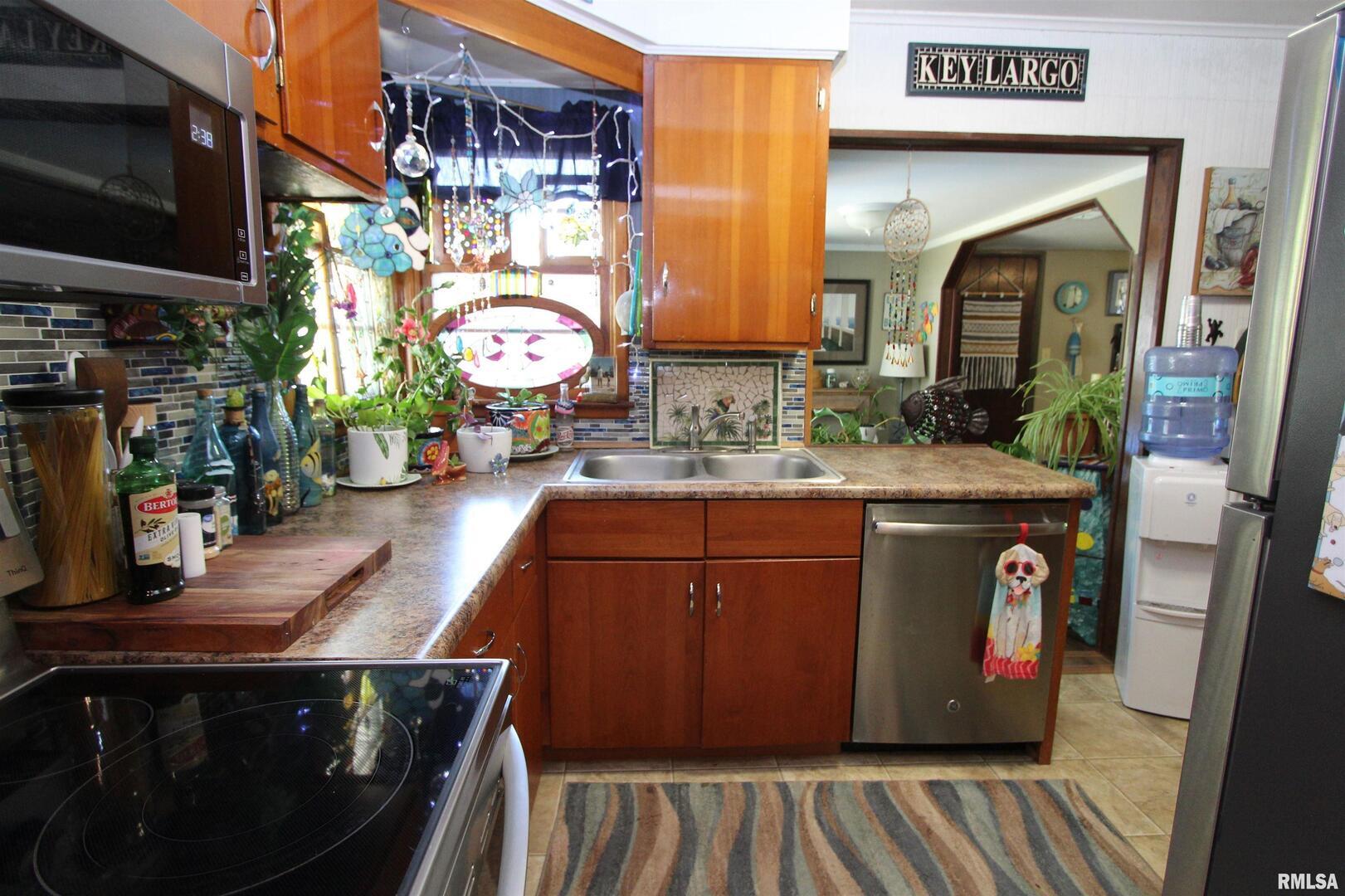 1330 Florence Avenue Clinton, IA 52732 - Photo 10 of 20 a bathroom with a sink and a mirror
