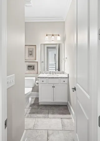 a bathroom with a sink a mirror and a vanity
