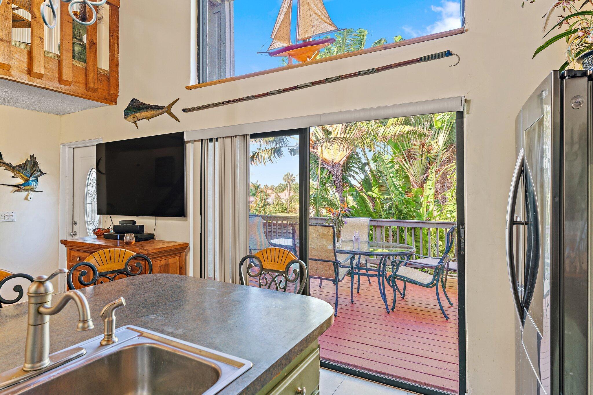 1605 Highway 1, Unit SL 5F Jupiter, FL 33477 - Photo 15 of 35 a view of a dining room with furniture window and outside view