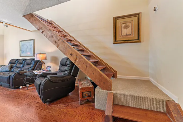 a bathroom with a toilet a sink and shower