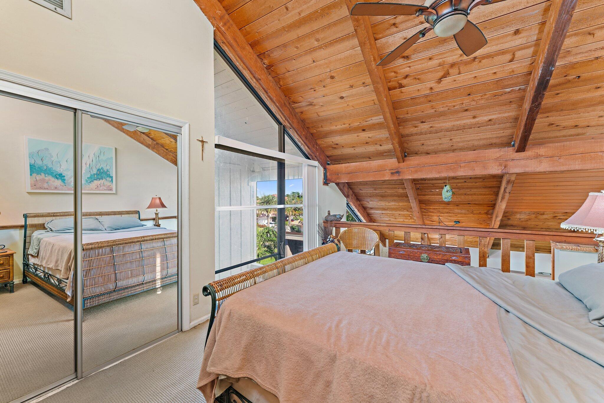 1605 Highway 1, Unit SL 5F Jupiter, FL 33477 - Photo 31 of 35 a bedroom with a bed a table and balcony