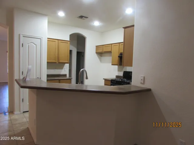 a kitchen with stainless steel appliances a sink and a refrigerator