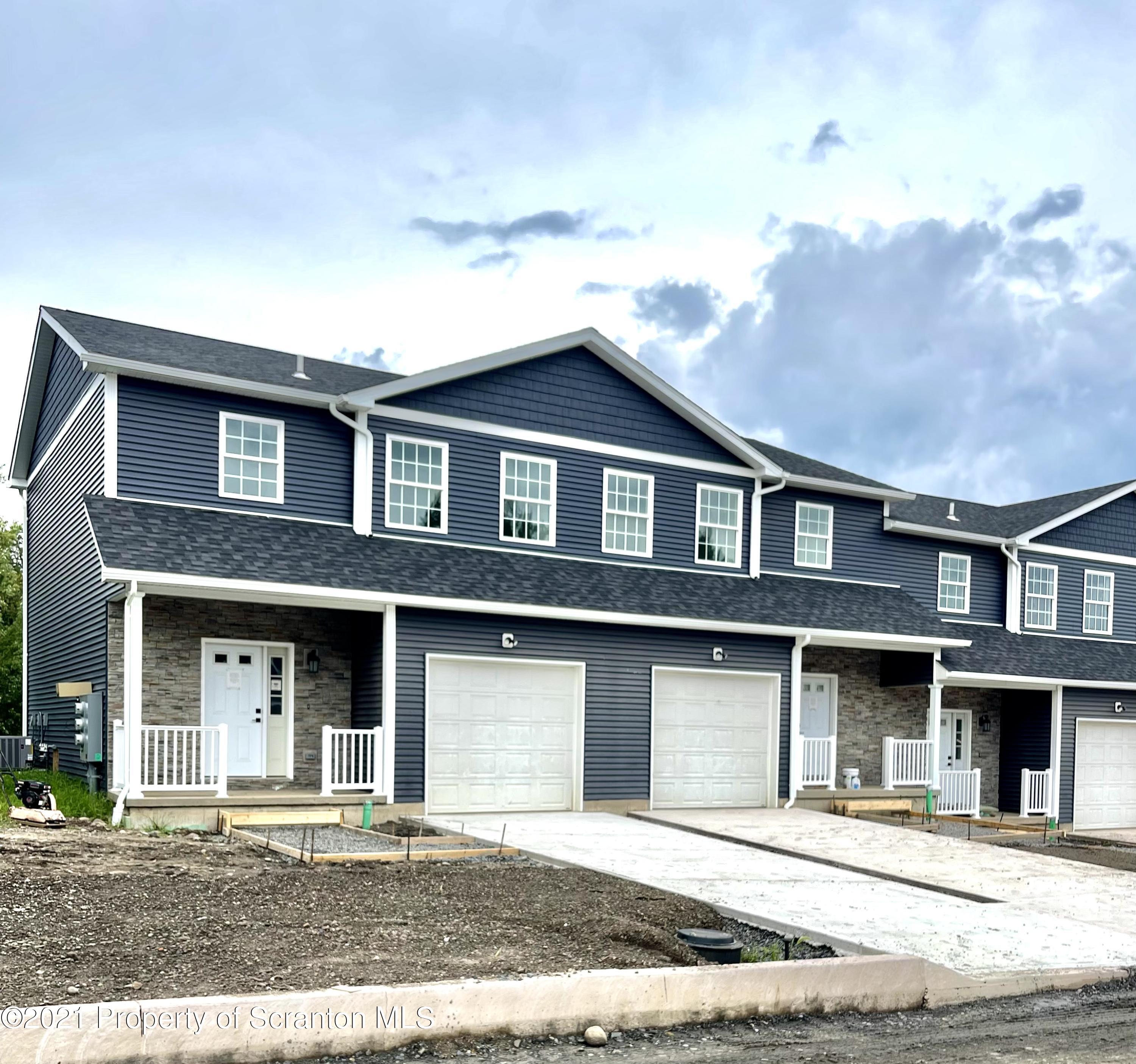 426 Felts Street Taylor, PA 18517 - Photo 7 of 9 a front view of a house with a yard